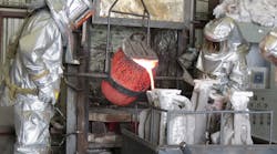 Pouring the molten bronze from the crucible into the investment shell requires skillful attention and a steady hand to produce a perfect casting Pouring the molten bronze from the crucible into the investment shell requires skillful attention and a steady hand to produce a perfect casting