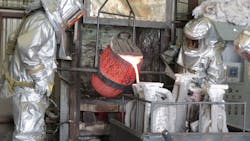 Pouring the molten bronze from the crucible into the investment shell requires skillful attention and a steady hand to produce a perfect casting Pouring the molten bronze from the crucible into the investment shell requires skillful attention and a steady hand to produce a perfect casting