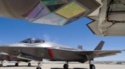 The F-35 Lightning II is a stealth fighter built by Lockheed for the U.S. Air Force, U.S. Marine Corps, U.S. Navy, and the Royal Air Force. The Electro-optical Targeting System (top of the photo, behind a sapphire window) is integrated with the fuselage and provides air-to-air and air-to-surface targeting capability.