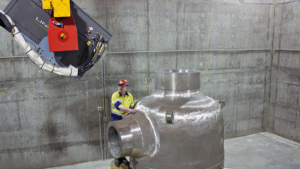 Bradken designed a new concrete building with 80times400fthigh walls and an 18inthick concrete roof to house two new radiographic systems a 9MeV linear accelerator and a Cobalt 60 projector and source