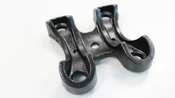 One view of the lower leafspring bracket that Gredersquos Reedsburg WI foundry is producing for the Chevrolet Silverado fullsize pickup One view of the lower leafspring bracket that Gredersquos Reedsburg WI foundry is producing for the Chevrolet Silverado fullsize pickup