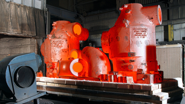 Largedimension ferrous castings seen exiting a heattreating chamber
