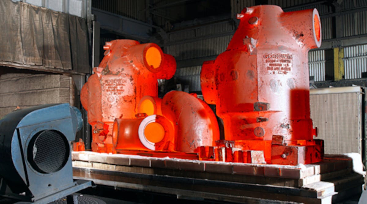 Large-dimension ferrous castings, seen exiting a heat-treating chamber.