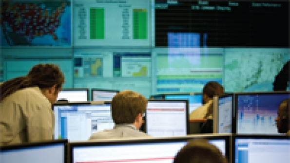 Technicians monitor electricity usage at thousands of customer sites track energy emergency triggers such as extreme weather conditions and coordinate energy reduction strategies