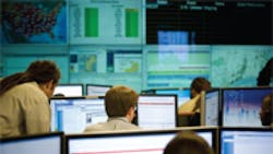 Technicians monitor electricity usage at thousands of customer sites track energy emergency triggers such as extreme weather conditions and coordinate energy reduction strategies Technicians monitor electricity usage at thousands of customer sites track energy emergency triggers such as extreme weather conditions and coordinate energy reduction strategies