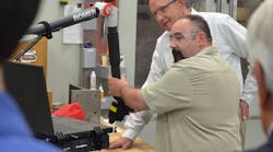 Mark Vance, advanced technical specialist at Clinkenbeard, demonstrates the capabilities of the Romer Absolute Arm.