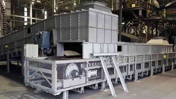 The MCC includes a tunnel held under negative pressure in which a stream of cooling air flows at controlled speed to avoid thermal shocks to the castings Ambient air is forced to enter the extremities of the cooling hood then sucked from the center of the hood itself Optical pyrometers detect casting temperature at the inlet middle and outlet of the tunnel