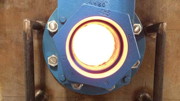 The view port of a test stand during the heated and pressurized test of ceramic tube seals shows the intense glow at 1800degF