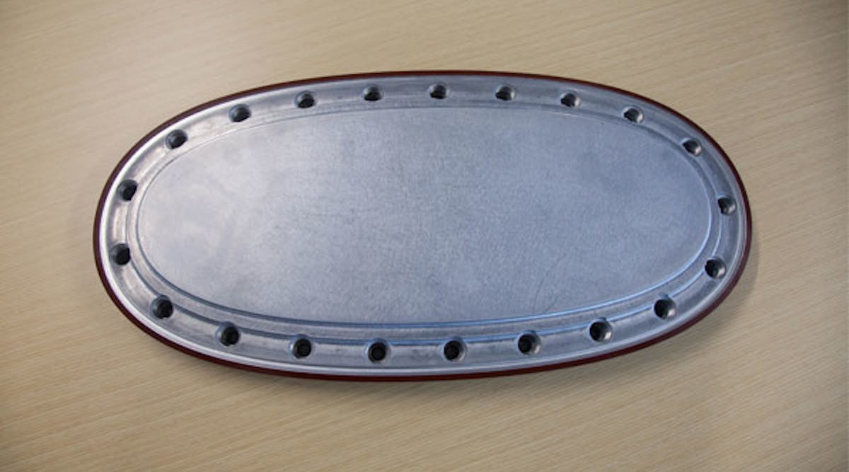 A diecast aluminum access panel from an aircraft wing structure. &ldquo;We hope to demonstrate that advances in high-vacuum diecasting will produce parts that meet all the rigorous performance specifications we require, while realizing weight and efficiency goals,&apos; a Boeing technician stated.