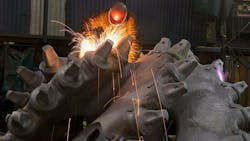 A worker at ESCOrsquos Main Plant in Portland uses an angle grinder to finish a cutting head for a dredging machine head A worker at ESCOrsquos Main Plant in Portland uses an angle grinder to finish a cutting head for a dredging machine head