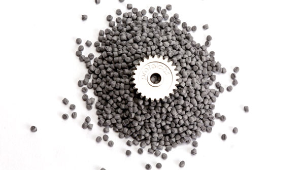 A fully dense part produced by ldquorapid manufacturingrdquo shown with the metal feedstock that is transformed by metal injection molding