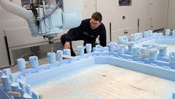AMRC Castings39 Neil Copley inspects a replica pattern cut from polystyrene on a CMS Industriesrsquo Poseidon fiveaxis machine to cast parts for frames to be used to build civil nuclearwaste storage vessels AMRC Castings39 Neil Copley inspects a replica pattern cut from polystyrene on a CMS Industriesrsquo Poseidon fiveaxis machine to cast parts for frames to be used to build civil nuclearwaste storage vessels