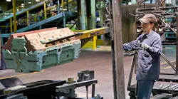 A General Motors worker positions an engine block mold at the Defiance Castings Operations in Ohio The automaker plans to discontinue ductile iron production there over the coming 18 months