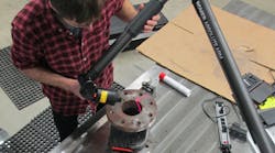 With a portable CMM arm PCMM and laptop on the shop floor parts can be scanned with the data points sent upstream for instant analysis comparison to the CAD file the CAM program comparable machines in the shop producing the same or similar parts and other actions in an information stream With a portable CMM arm PCMM and laptop on the shop floor parts can be scanned with the data points sent upstream for instant analysis comparison to the CAD file the CAM program comparable machines in the shop producing the same or similar parts and other actions in an information stream