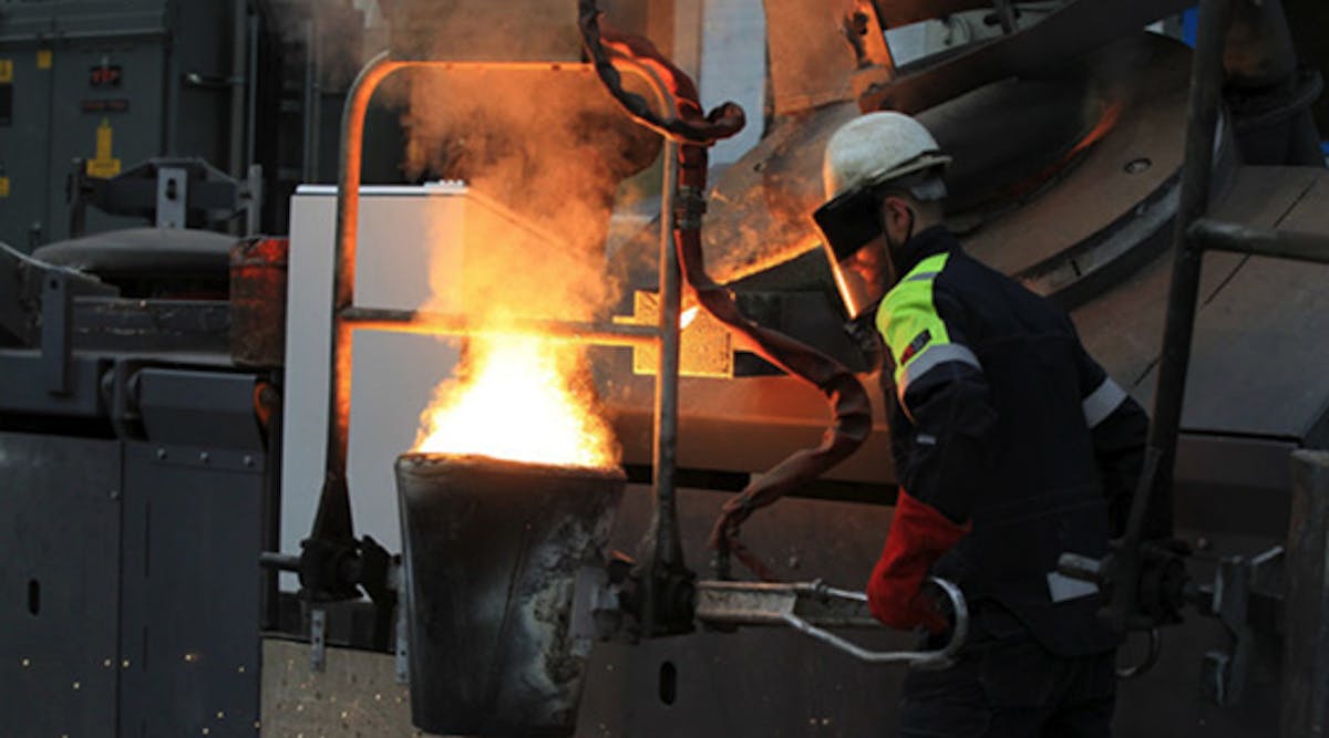 Pouring molten metal at William Cook Cast Products in Sheffield, England.
