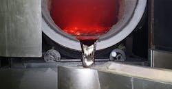 Pouring molten aluminum Pouring molten aluminum