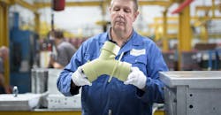 Aeromet Intl worker w/prototype Aeromet Intl worker w/prototype