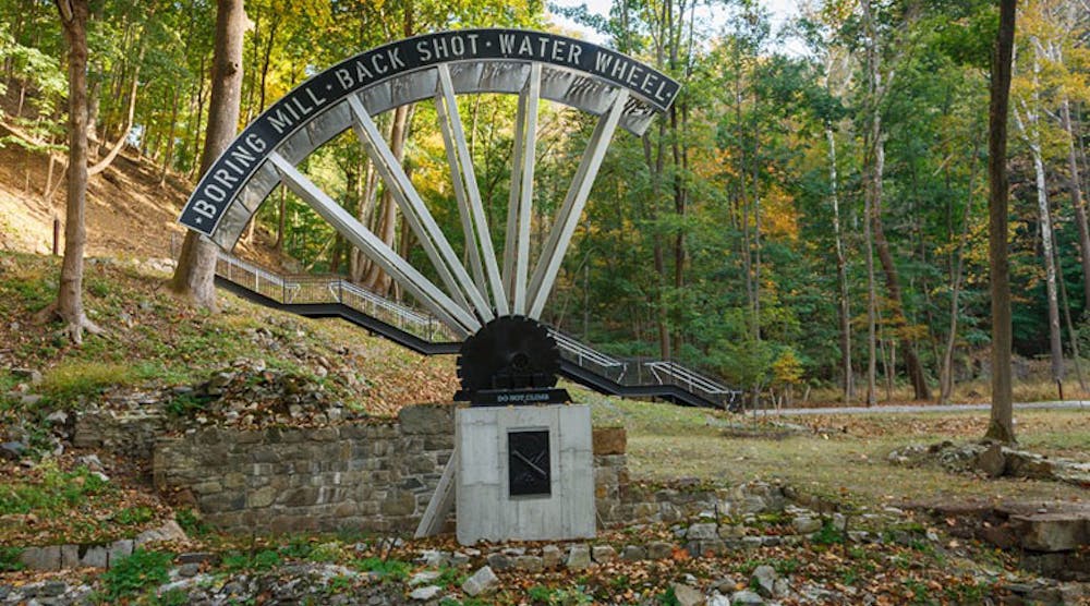 A full-scale sculptural model of a 36-ft water wheel that powered a boring mill at West Point Foundry.