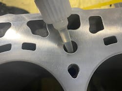 Sealant is applied into a bolt hole where porosity and leakage has been identified. Sealant is applied into a bolt hole where porosity and leakage has been identified.