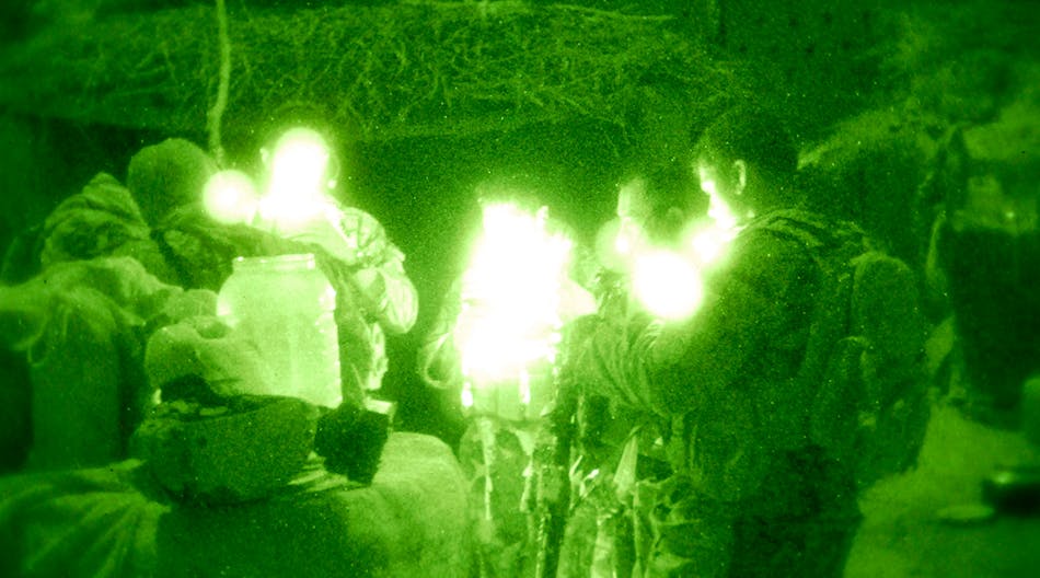 Service members from Special Operations Task Force - South review their maps during the pre-dawn hours of Oct. 30, 2010, in the village of Talukan, Panjwa&rsquo;i District, Afghanistan. A combined force consisting of nearly 100 Afghan Commandos from 4th Commando Kandak, combat advised by a team from SOTF-S, were in the village to rid the area of insurgents, gather intelligence and neutralize any improvised explosive devices.