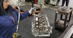 Finishing a semi-permanent mold cast cylinder head at GM's Defiance Casting Operations. Finishing a semi-permanent mold cast cylinder head at GM's Defiance Casting Operations.