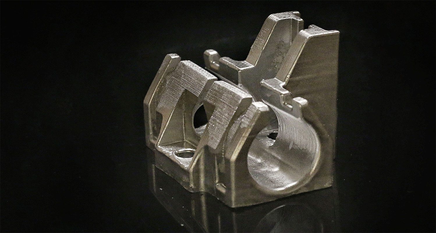 A Ti-6Al-4V bracket for a linear guide, manufactured by gel casting as a demonstrator component.