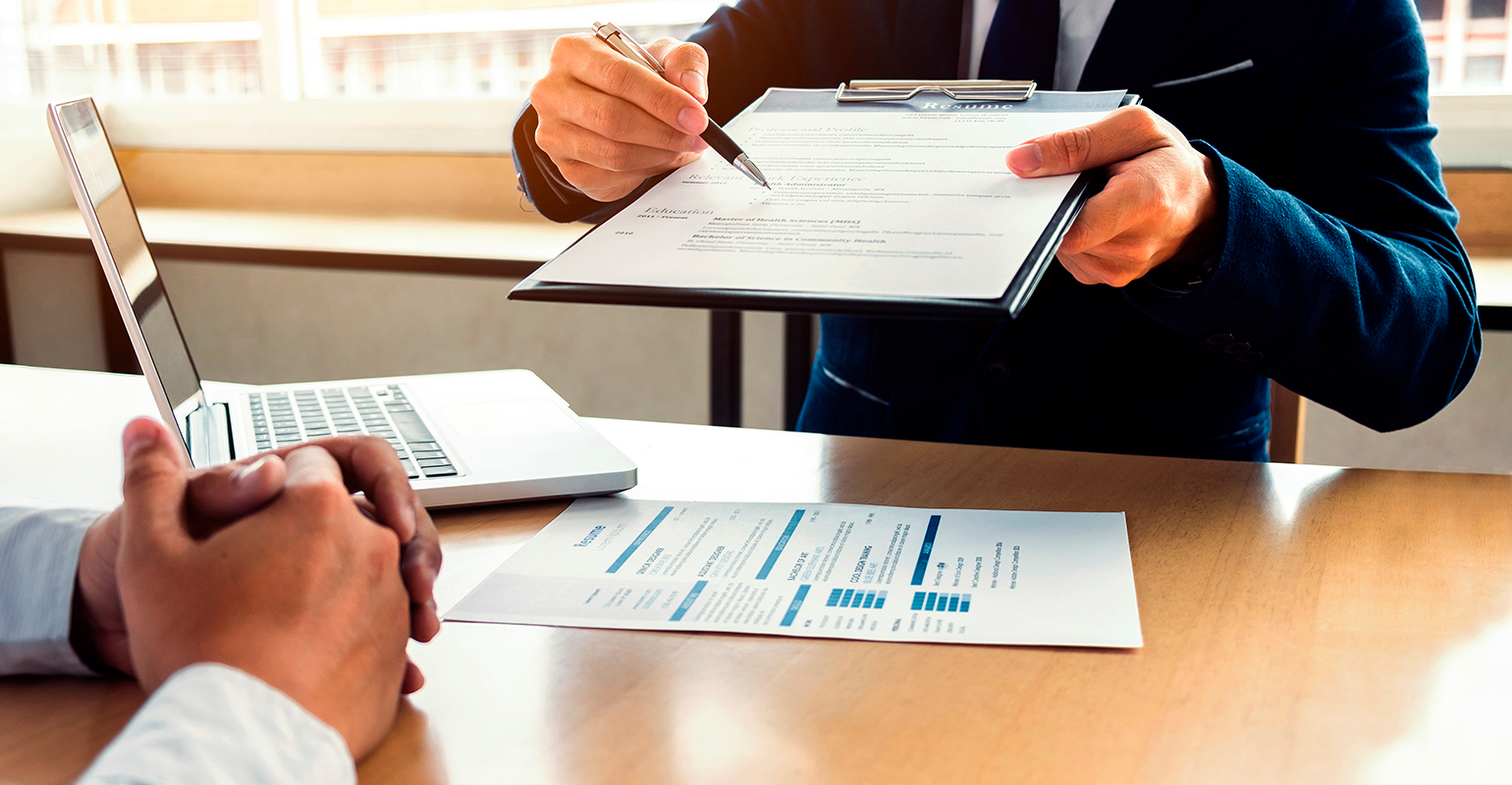 Job interview... 'Sign here.'