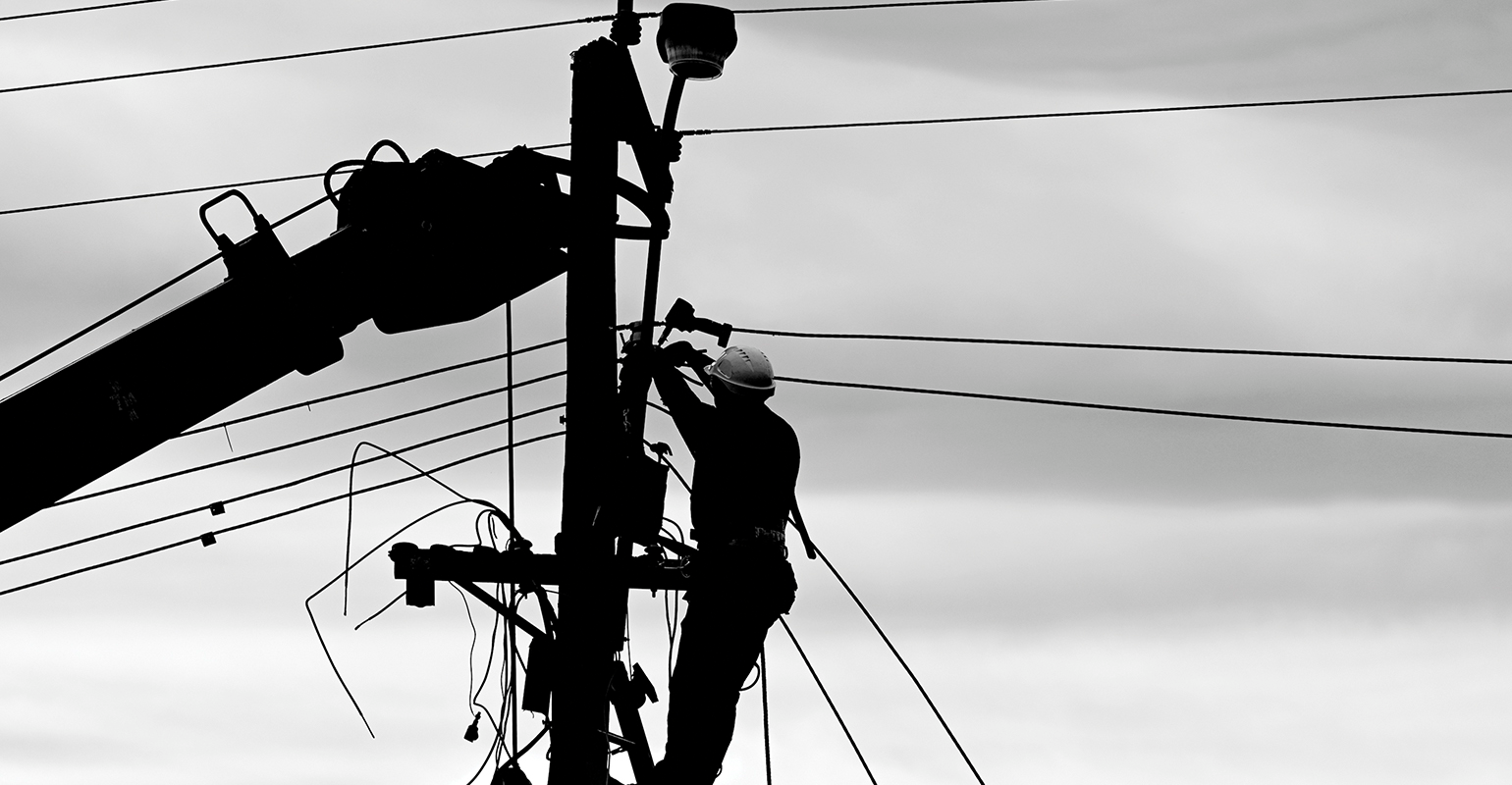 Lineman servicing a power line.