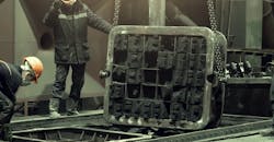 Opening a sand mold. Opening a sand mold.