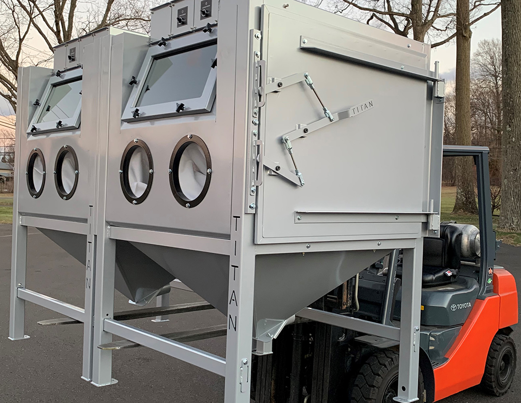 Titan Abrasive System blast cabinet with lifting bards added to the steel frame.