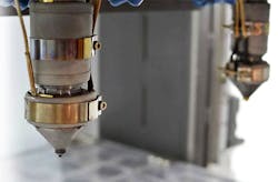 Titan Additive LLC (Titan Robotics) dual FDM heads for polymer-based extrusion. Titan Additive LLC (Titan Robotics) dual FDM heads for polymer-based extrusion.