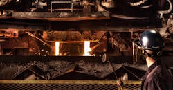 A worker tends a dual stream pouring process at Waupaca Foundry in Etowah, TN. A worker tends a dual stream pouring process at Waupaca Foundry in Etowah, TN.