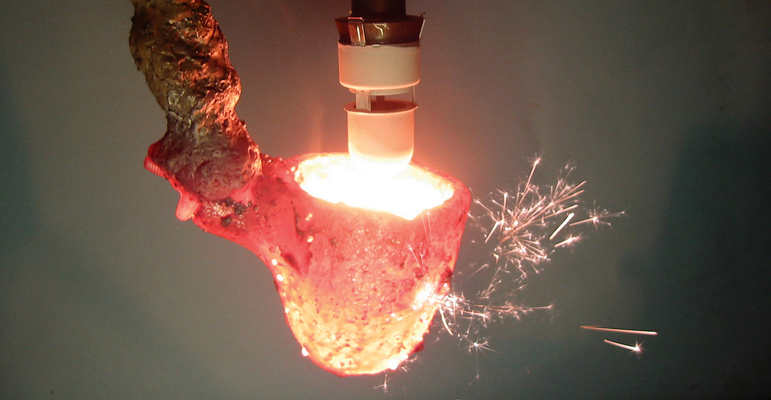 SinterCast sampling cup during compacted graphite iron refining.