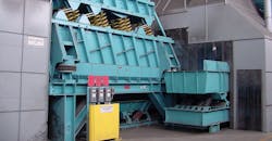 A General Kinematics two-mass vibratory shakeout machine. A General Kinematics two-mass vibratory shakeout machine.