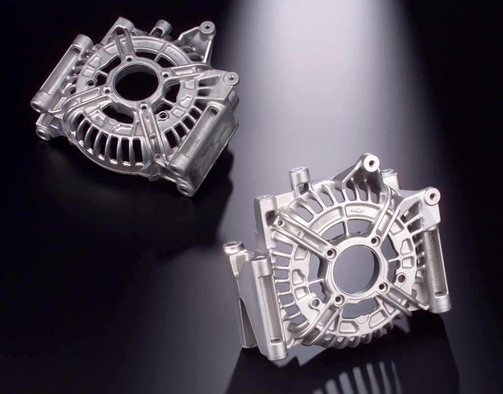 Shot-blast machines with automated workpiece handling for continuous processing of lightweight, nonferrous castings within required cycle times include de-sanding, deburring, and surface homogenization. With a compact design the machine can be integrated into automated manufacturing lines for high throughput of automotive parts.