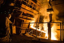 Pouring molten steel from an electric furnace.