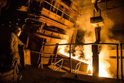 Pouring molten steel from an electric furnace. Pouring molten steel from an electric furnace.