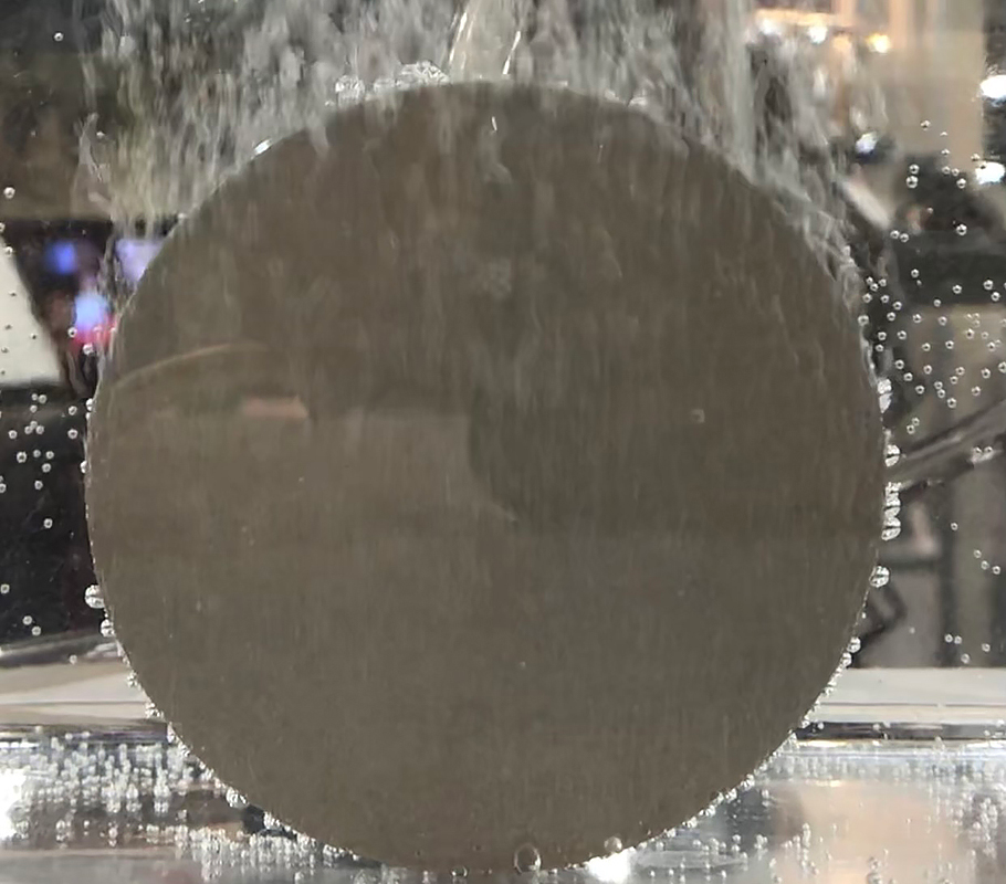 A billet of Vortex&circledR; steel can be seen venting in water at 10 PSI.