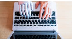 Robot hands and fingers point to laptop button: Artificial Intelligence.