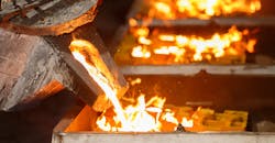 Pouring molten iron. Pouring molten iron.