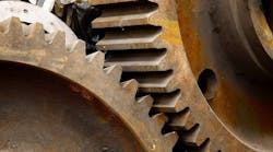 Corrosion on steel gears of an industrial crane.