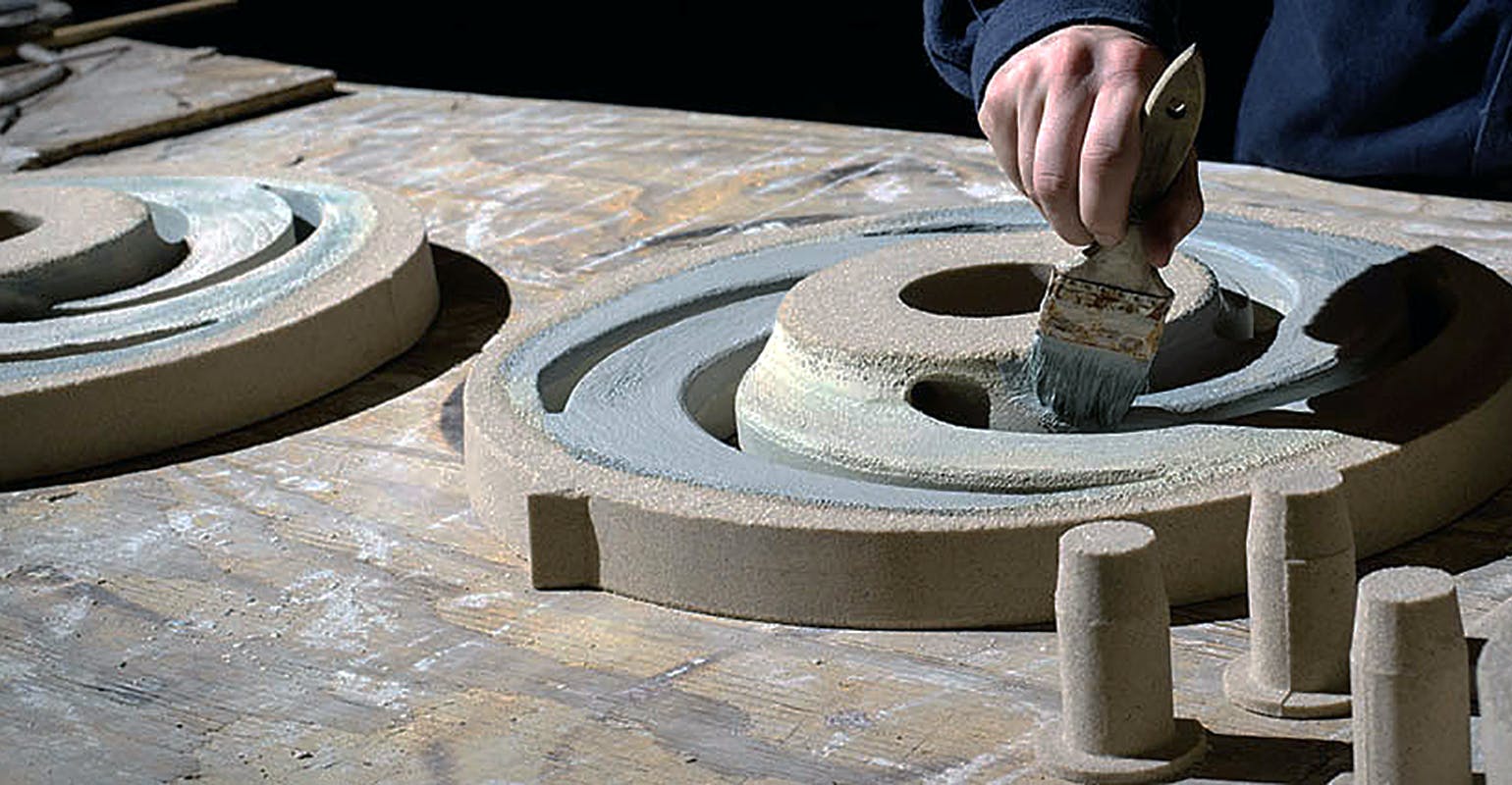 Sealant is applied to a printed sand mold at Howell Foundry, St. Francisville, Louisiana