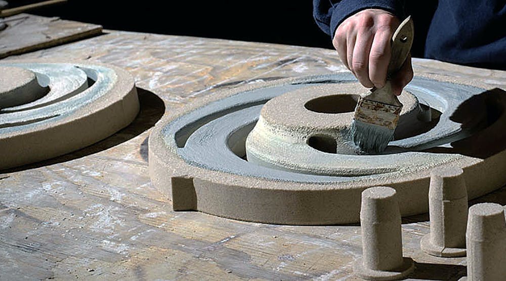 Sealant is applied to a printed sand mold at Howell Foundry, St. Francisville, Louisiana
