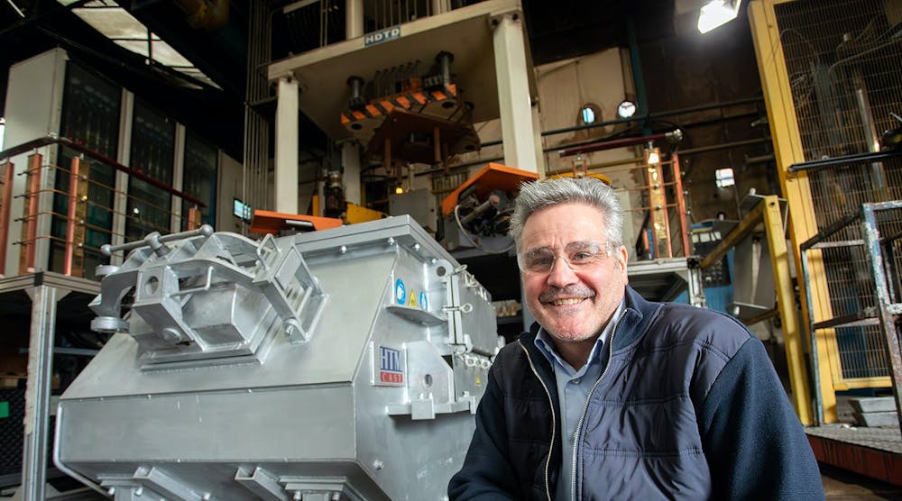 Alucast Ltd. managing director Martin Haynes, Managing Director of Alucast, in front of the 800-mt high-pressure machine recently installed in the U.K. foundry.