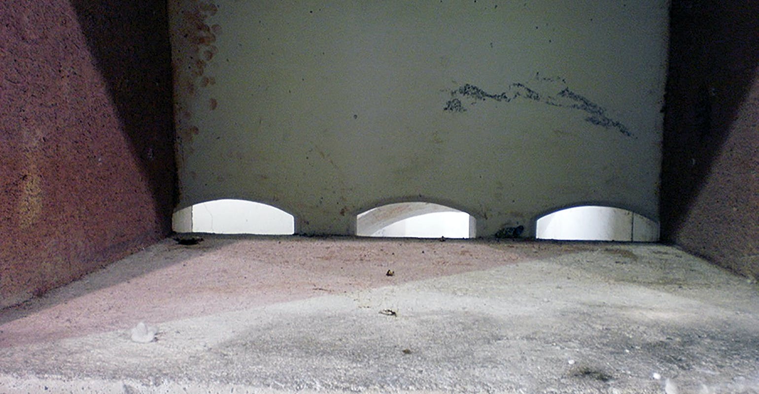 The dry hearth at the bottom of the stack furnace is an area of particular concern, especially if furnace tenders load the furnace with the stack empty. That means that scrap and ingots fall 6-12 feet onto that hot refractory hearth. No refractory material can withstand that very long. The best solution is to never let the stack get empty.