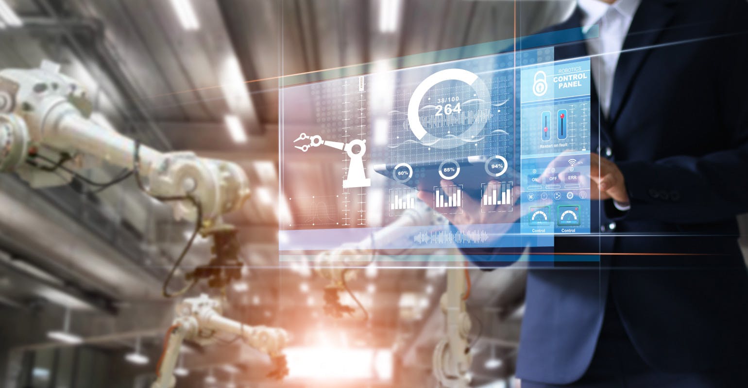 Manager/industrial engineer using tablet.