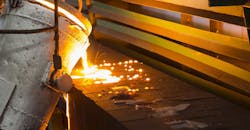 Pouring molten iron into green sand molds. Pouring molten iron into green sand molds.
