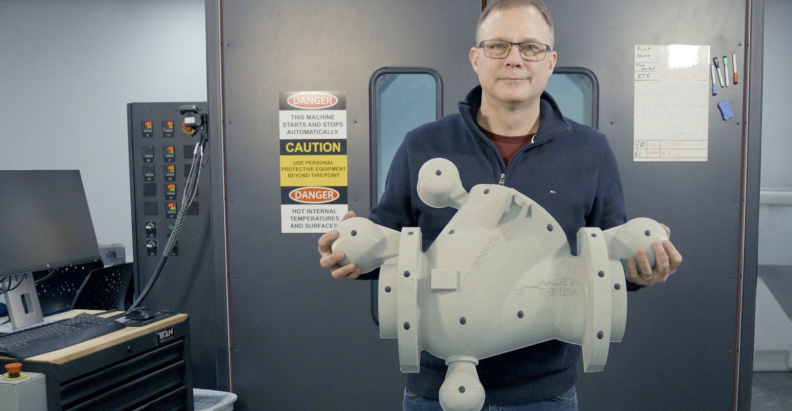 Astech engineering manager Bob Helwer holds a pattern printed on the company&rsquo;s EXT Titan Pellet 3D printer.