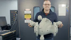 Astech engineering manager Bob Helwer holds a pattern printed on the company’s EXT Titan Pellet 3D printer.