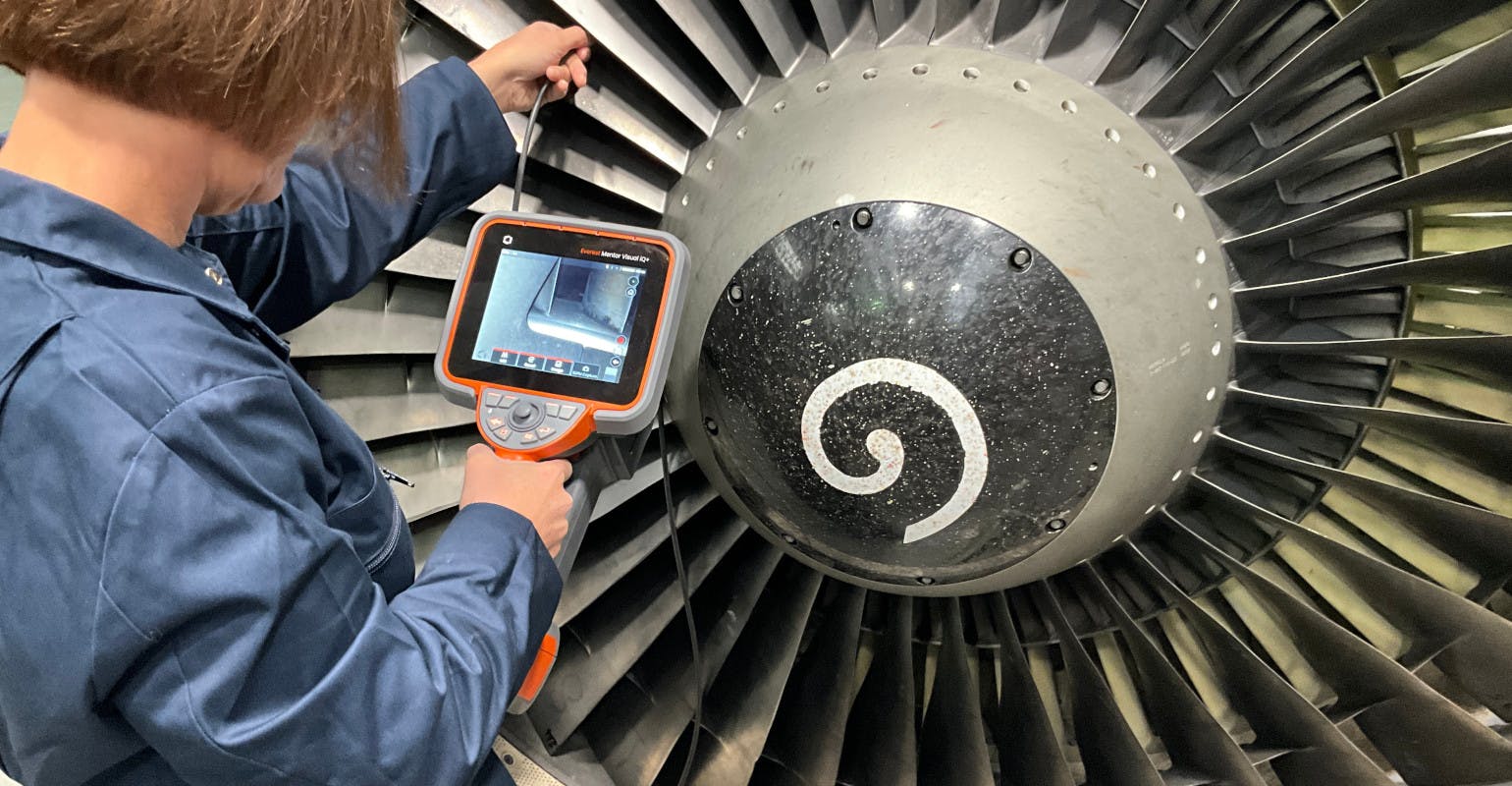 An engineer inspects a turbofan engine using Waygate Technologies&rsquo; Mentor Visual iQ+ borescope. Waygate and GE Aerospace jointly developed an AI-enhanced version of the device that will be made available to customers through an upcoming software update